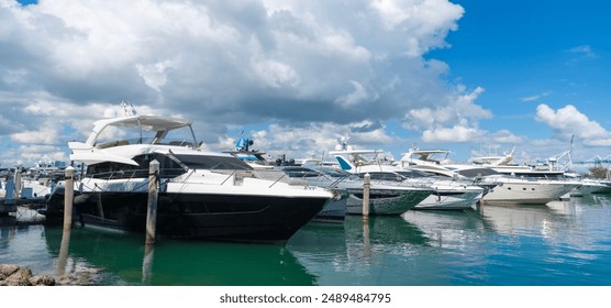 Luxurious yacht marina. Luxury boat. Marina in Miami Beach, Florida USA. Yacht boat docked on sea Biscayne bay. Downtown Miami Marina with luxury yacht boat. Summer vacation - Powered by Shutterstock