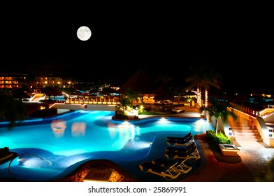 a luxury all inclusive beach resort at night in Cancun Mexico - Powered by Shutterstock