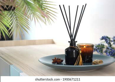 Luxury Aroma Scent Reed Diffuser Glass Bottle Is On The Wooden Table And Amber Glass Of Scented Candle To Creat Romantic And Relax Ambient In The Bedroom In The Morning On Happy Valentine Day