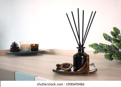 Luxury Aroma Scent Reed Diffuser Glass Bottle Is On The Wooden Table And Amber Glass Of Scented Candle To Creat Romantic And Relax Ambient In The Bedroom In The Morning On Happy Valentine Day