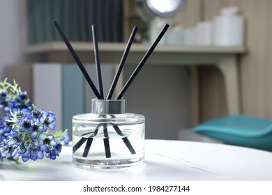 luxury aromatic scent of reed diffuser glass bottle is used as room freshener and decorate on the white marble table in the bedroom to creat relax and romantic ambient with background of nice room - Shutterstock ID 1984277144