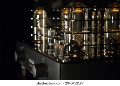 Luxury Audio Tube Amplifier On Black Background. Closeup Abstraction