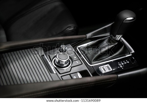 Luxury automatic car transmission control buttons\
and gear lever.