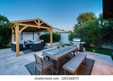 a luxury back patio with a pool in the evening  - Shutterstock ID 2201360073