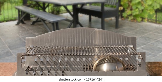 Luxury Barbecue Stainless Steel Shiny Combo Grill Isolated. Outdoor Kitchen Grill Table. Clean Barbeque Grill Appliance With Marbled Tabletop. Outdoor BBQ Charcoal Grill Isolated On White  Background.