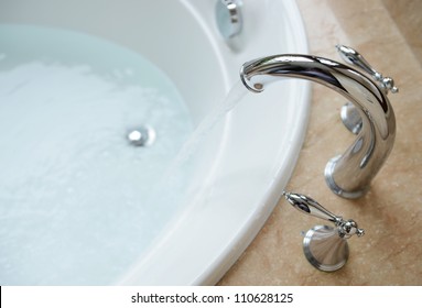 Luxury Bath Tub And Faucet With Water.