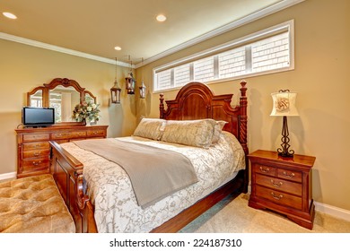 Luxury Bedroom With Carved Wood Bed, Nightstand, Vanity Cabinet With Mirror And Decorative Lanterns