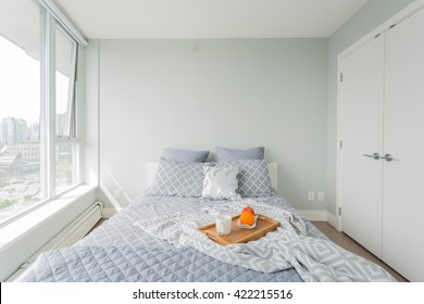 Luxury Bedroom. Contemporary Design With Reclaimed Wood Bedside Tables And Lamp. Nice And Cozy Accommodations. Hotel Or Resort Room. Vancouver Downtown View.