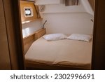 A luxury bedroom with a double bed in a yacht