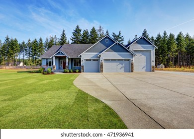 Luxury Blue House With Curb Appeal. Three Car Garage And Long, Wide Asphalt Driveway. Northwest, USA