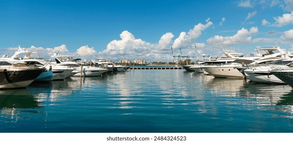 Luxury boat motor yacht in marina on Biscayne Bay. Sailboat moored to pier in yacht marina. Sailing and yachting tourism. Luxury lifestyle. Vacations on summer. Yacht at sea port. Yacht marina - Powered by Shutterstock