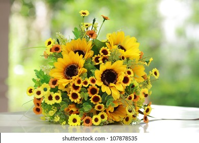 Luxury Bouquet ,beautiful Bouquet Of Bright Yelloe Flowers, Plastics Flower,on  Wooden Table With Nature Green Background.