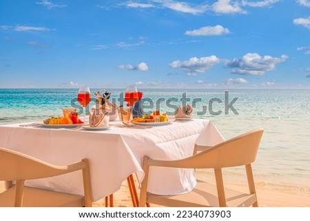 Luxury breakfast table beautiful tropical sea sky background. Idyllic romantic morning love couples time at summer holiday. Honeymoon romance vacation concept. Travel and lifestyle, destination dining