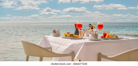 Luxury Breakfast Table With Food For Two With Beautiful Tropical Sea View Background. Morning Couple Time Summer Holiday And Romantic Vacation Concept, Luxury Travel And Lifestyle, Destination Dining