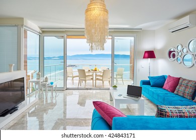 Luxury Bright Interior Of Villa Living Room With Marble Floor With Sea View With  Modern Color Furniture Flat Screen Tv, Laptop And Terrace Bodrum Turkey - Sucessful Sea Life Concept Or Work At Home