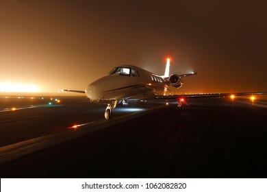 Luxury Business Jet Ready For Take Off At The Runway At Night 