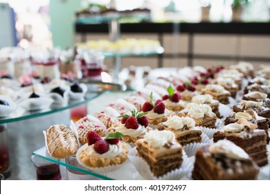 Luxury cakes on wedding dessert table in restaurant
