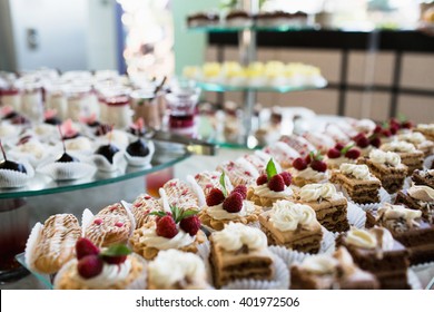 Luxury Cakes On Wedding Dessert Table In Restaurant