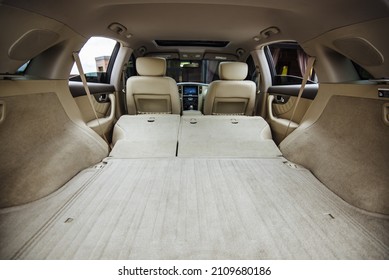 Luxury Car Boot With Folded Seats. Opened Empty Car Trunk. Clean Trunk Of The SUV. Organization Of Space In The Trunk Of The Car. Film Noise 