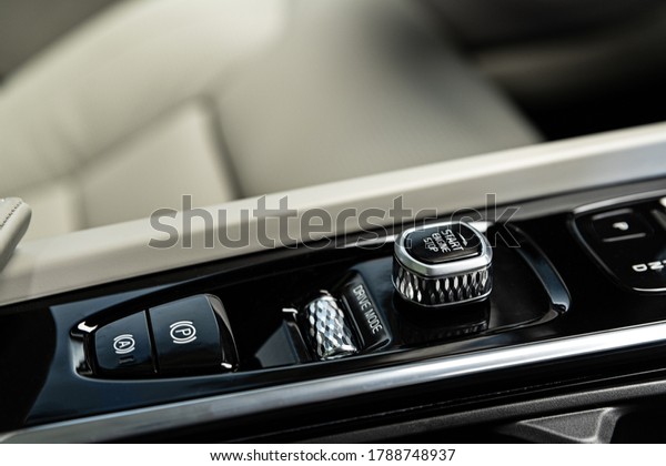 Luxury car control panel with start stop engine\
switch. Modern car