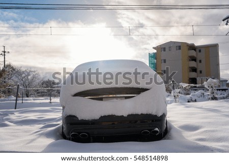luxury car cover with fresh white snow