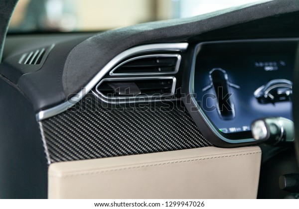 Luxury car design elements, side mirrors, door\
upholstery, interior, steering wheel, wheels, leather, front and\
rear lights, controls