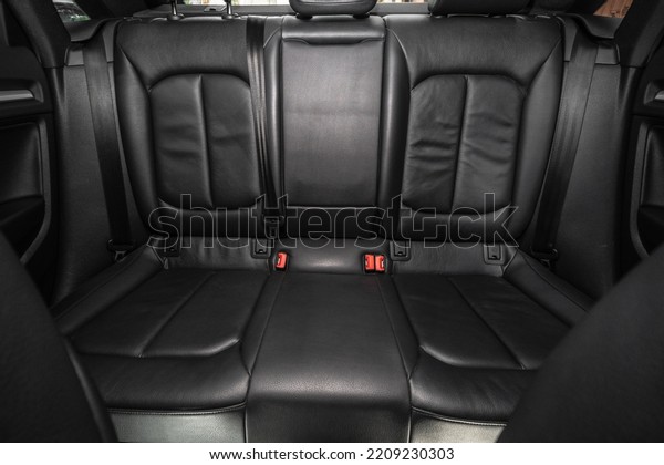 Luxury car inside. after\
capital, detailed dry cleaning. Shine and purity. Car wash.\
Service. Interior of prestige modern car. Rear passenger row of\
seats. Black leather.