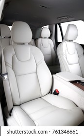 Luxury Car Inside. Interior Of Prestige Modern Car. Comfortable Leather Seats. White Leather Cockpit With Isolated White Background.