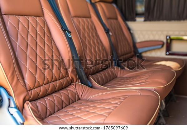 Luxury car interior. Car
interior luxury service.
Leather interior of a minibus. Beige
leather interior