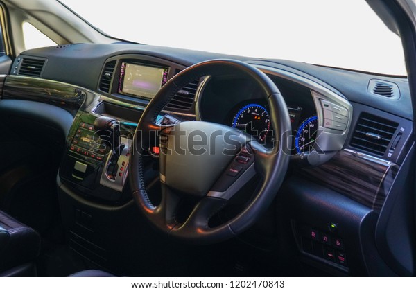 Luxury car interior. Steering wheel, shift\
lever and dashboard.the inside of the\
car