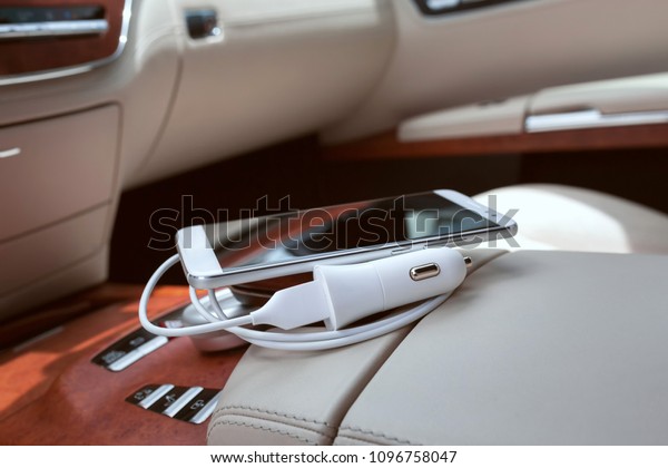 Luxury car mobile phone charger close-up. Luxury\
accessories 
