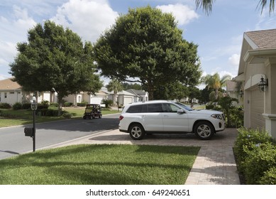 Luxury Car Parked On The Driveway Of A House In A Florida Residential Area, USA 2017