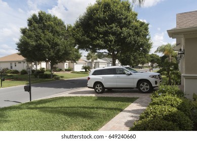 Luxury Car Parked On The Driveway Of A House In A Florida Residential Area, USA 2017