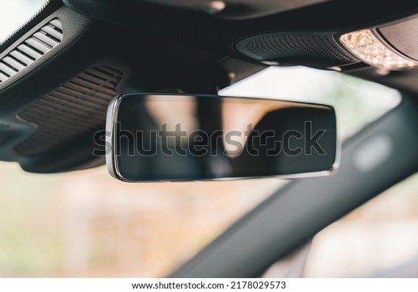 Luxury car\
rear view mirror. Car interior\
detail.