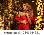 Luxury Christmas and New Year. Portrait of a gorgeous blonde woman in an elegant long red dress posing in a rich Christmas interior. Evening Fashion. Copy space.