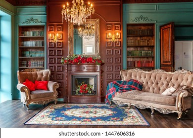 Luxury Classic Interior Of Home Library. Sitting Room With Bookshelf, Books, Arm Chair, Sofa And Fireplace. Clean And Modern Decoration With Elegant Furniture. Education Read Study Wisdom Concept