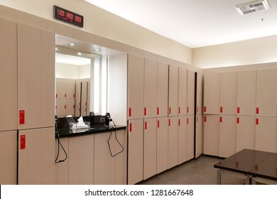 Luxury And Clean Locker Room Or Changing Room In The Fitness Gym Center, Including Hair Dryer And Mirror.