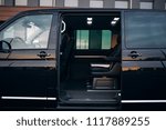 Luxury and comfortable van with an open door. A VIP van is prepared for the transportation of passengers. Transfer from airport with a comfortable seats and free space 