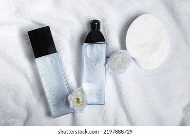 Luxury Cosmetic Products, Flowers And Cotton Pads On White Towel, Flat Lay