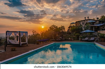 Luxury Country House With Swimming Pool In Italy. Pool And Old Farm House During Sunset Central Italy