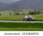 Luxury coupe grand tourismo car journey on scenic countryside road