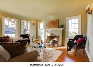 Luxury cozy living room. Green walls, beige tones and cozy craftsman style. Tacoma, WA