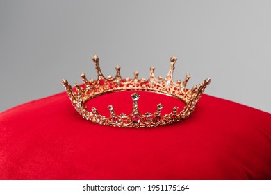 Luxury Crown On Red Velvet Cushion Isolated On Grey