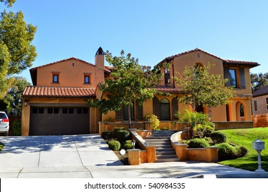 Luxury custom made houses and mansions with a nicely landscaped front yard in the rich suburb of Pasadena, California.