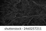 luxury dark black breccia marble stone showing beautiful mineral veins for interior decoration. natural breccia marble tiles for wall and floor finishing, Emperador premium glossy slab stone.