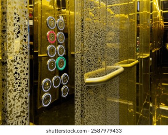 Luxury Elevator Interior With Illuminated Floor Buttons And Gold-Tinted Mirror Walls. Elegant And Modern Design For Hotels, Offices, And High-End Residences.