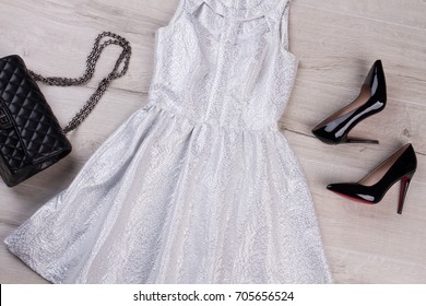 silver dress with black heels