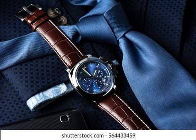 luxury fashion watch with blue dial and brown crocodile grain leather watch band
