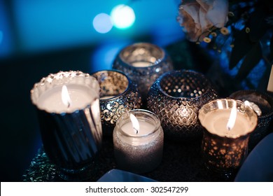 Luxury, Fashion Wedding Decoration Wedding, Wedding Table, Restaurant. Candles, Glasses, Glare, Color Close-up. Wedding Ceremony In The Winter.