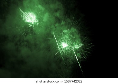 Luxury Fireworks Event Sky Show With Green Big Bang Stars. Premium Entertainment Magic Star Firework At E.g. New Years Eve Or Independence Day Party Celebration. Black Dark Night Background